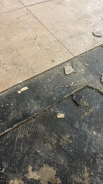 Black bitumen mastic floor removal in a NW9 flat